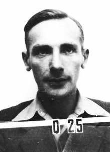 Wartime identification badge portrait of physicist Joseph Rotblat at Los Alamos.